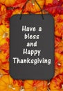 Happy Thanksgiving greeting on a chalkboard sign on pumpkins Royalty Free Stock Photo