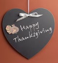 Happy Thanksgiving message written on heart shape blackboard Royalty Free Stock Photo