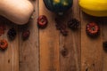 Happy Thanksgiving. Pumpkins, cones and dry leaves on a wooden background. View from above. Flat layer Royalty Free Stock Photo