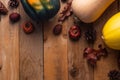 Happy Thanksgiving. Pumpkins, cones and dry leaves on a wooden background. View from above. Flat layer Royalty Free Stock Photo