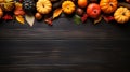 Happy Thanksgiving. Pumpkins with fruits and falling leaves on black rustic wooden table