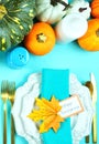 Happy Thanksgiving setting modern elegant blue orange and white table flat lay. Royalty Free Stock Photo