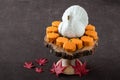 Happy Thanksgiving, small pumpkin cakes, white ceramic turkey on a wooden cake stand, red maple leaves