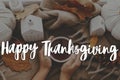 Happy Thanksgiving! Happy thanksgiving text and hands holding warm cup of tea flat lay with stylish pumpkins and fall leaves. Royalty Free Stock Photo