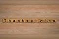 Happy Thanksgiving written on wood cubes. Royalty Free Stock Photo