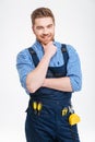 Happy thoughtful male builder looking at camera Royalty Free Stock Photo