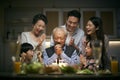 Three generation asian family celebrating grandpa`s birthday at home Royalty Free Stock Photo