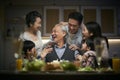 Three generation asian family celebrating grandpa`s birthday at home Royalty Free Stock Photo