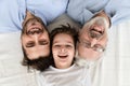 Happy three generation family lying in row, portrait, closeup view Royalty Free Stock Photo