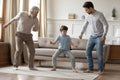 Happy three generations of men dance at home Royalty Free Stock Photo