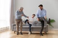 Happy three generations of men dancing together Royalty Free Stock Photo