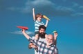 Happy three generations of men have fun and smiling on blue sky background. Father and son playing outdoors. Airplane Royalty Free Stock Photo