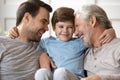 Happy three generations of men play at home Royalty Free Stock Photo