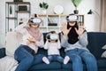 Happy three generations of muslim women watching in modern augmented vr headset reality glasses Royalty Free Stock Photo