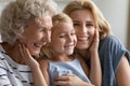 Happy three generations of women relax at home together Royalty Free Stock Photo