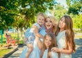 Happy three little cute girls, her mother four members family Royalty Free Stock Photo