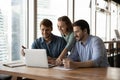 Happy three teammates working together on online project. Royalty Free Stock Photo