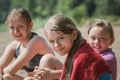 Happy three teen friends girls on beach after swimming Royalty Free Stock Photo