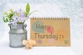 Happy Thursday on design notebook cover with smiling elephant clay and tin flower pot