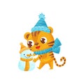 Happy tiger sculpts snowman on white background. Royalty Free Stock Photo