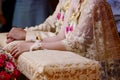 Happy time of newlywed couple in water relaunch ceremony. Thai traditional wedding. Selective focus and shallow depth of field. Royalty Free Stock Photo