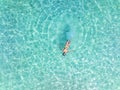 Happy time and relaxation lifestyle of young woman in the water ocean in yellow bikini -Summer concept