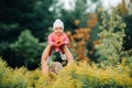 Happy time together. Mother playing with her baby, holding kid on hands Royalty Free Stock Photo