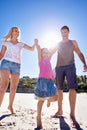 Happy times on the beach. a happy young family taking a walk on the beach. Royalty Free Stock Photo