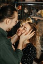 Happy to be together. Beautiful young couple embracing and smiling while spending time in the kitchen Royalty Free Stock Photo