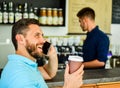 Happy to hear you. Confident entrepreneur choose drink in paper cup to go while communicate mobile. Man speak mobile Royalty Free Stock Photo