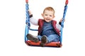 Happy toddler baby boy rides on a swing, isolated on a white backgrou Royalty Free Stock Photo