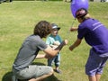 Happy toddler being given a Balloon in a park in Surrey