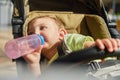 Happy toddler boy drinking baby formula from bottle in shopping mall Royalty Free Stock Photo