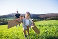 Happy toddler boy playing outside with father in spring nature. Royalty Free Stock Photo