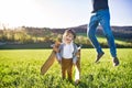 Happy toddler boy playing outside with father in spring nature. Royalty Free Stock Photo