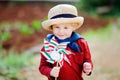 Happy toddler boy holding Italian flag outdoors Royalty Free Stock Photo