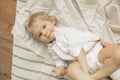 Happy toddler boy lies on bed Royalty Free Stock Photo