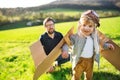 Happy toddler boy playing outside with father in spring nature. Royalty Free Stock Photo