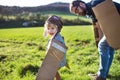 Happy toddler boy playing outside with father in spring nature. Royalty Free Stock Photo