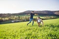 Happy toddler boy playing outside with father in spring nature. Royalty Free Stock Photo