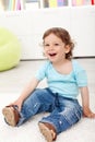 Happy toddler boy sitting on the floor Royalty Free Stock Photo