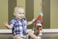 Happy Toddler Boy and Sock Monkey