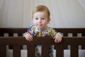 Cute toddler in cot