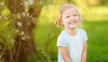 Happy toddler girl outdoors portrait in summer day