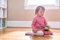 Happy toddler girl playing with her toys Royalty Free Stock Photo