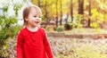 Happy toddler girl playing outside in fall Royalty Free Stock Photo