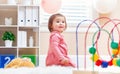 Happy toddler girl playing with toys Royalty Free Stock Photo