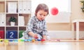 Happy toddler girl playing with toys Royalty Free Stock Photo