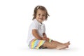 Happy toddler girl sitting on the floor Royalty Free Stock Photo