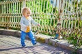 Happy toddler girl walking in the street of Helsinki, Finland Royalty Free Stock Photo